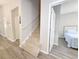 Carpeted stairs leading to upper level with bedroom view at 663 Pinehurst Dr. # 93C, Pawleys Island, SC 29585