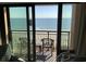 Balcony view overlooks ocean with chairs, providing a relaxing outdoor space at 6900 N Ocean Blvd. # 614, Myrtle Beach, SC 29572