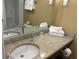 Well-lit bathroom with granite counters, fresh towels, and modern fixtures at 6900 N Ocean Blvd. # 614, Myrtle Beach, SC 29572