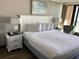 Charming bedroom with a queen bed, stylish lamps, and comfortable chair for a relaxing stay at 6900 N Ocean Blvd. # 614, Myrtle Beach, SC 29572