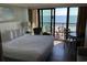 Scenic bedroom with stunning ocean view, comfortable king bed, and access to balcony at 6900 N Ocean Blvd. # 614, Myrtle Beach, SC 29572
