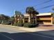 The building is fronted by neatly trimmed shrubbery and tall palm trees at 6900 N Ocean Blvd. # 614, Myrtle Beach, SC 29572