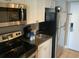 Fully equipped kitchen with stainless steel appliances and white cabinetry, perfect for simple meal preparation at 6900 N Ocean Blvd. # 614, Myrtle Beach, SC 29572