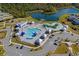 Aerial view of the community pool and lake at 7015 River Bridge Ct, Myrtle Beach, SC 29579