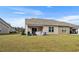 Large backyard with patio and grill at 7015 River Bridge Ct, Myrtle Beach, SC 29579