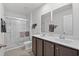 Clean bathroom with dual sinks and a walk-in shower at 7015 River Bridge Ct, Myrtle Beach, SC 29579