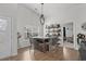 Bright dining area with four chairs and a rustic table at 7015 River Bridge Ct, Myrtle Beach, SC 29579