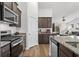Modern kitchen with stainless steel appliances and granite countertops at 7015 River Bridge Ct, Myrtle Beach, SC 29579