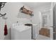 Convenient laundry room with washer, dryer, and extra storage at 7015 River Bridge Ct, Myrtle Beach, SC 29579