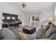 Spacious living room with sectional sofa and sliding glass doors at 7015 River Bridge Ct, Myrtle Beach, SC 29579