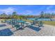 Community picnic tables and grills by the lake at 7015 River Bridge Ct, Myrtle Beach, SC 29579