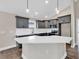 Modern kitchen with gray cabinets, white quartz countertops, and island at 8183 Kerl Rd., Conway, SC 29526