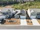 Three-house aerial view showing houses with yards and driveways at 9179 Fort Hill Way, Myrtle Beach, SC 29579