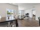Bright dining area with hardwood floors and sliding glass doors leading to a patio at 9179 Fort Hill Way, Myrtle Beach, SC 29579