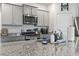 Granite countertop kitchen with stainless steel appliances at 9179 Fort Hill Way, Myrtle Beach, SC 29579