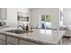 Kitchen island with granite countertop and stainless steel sink at 9179 Fort Hill Way, Myrtle Beach, SC 29579