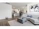 Living room with an open concept layout, showcasing a modern kitchen and comfy seating at 9179 Fort Hill Way, Myrtle Beach, SC 29579