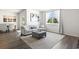 Open living room with hardwood floors, neutral decor, and a comfy sofa at 9179 Fort Hill Way, Myrtle Beach, SC 29579
