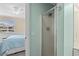 Small bathroom with shower and view into bedroom at 9560 Shore Dr. # 3A, Myrtle Beach, SC 29572