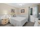 Bedroom with queen bed, wicker dresser, and window at 9560 Shore Dr. # 3A, Myrtle Beach, SC 29572