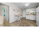 Simple kitchen with white cabinets and small dining area at 9560 Shore Dr. # 3A, Myrtle Beach, SC 29572