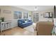 Relaxing living room with blue sofa and ocean-themed decor at 9560 Shore Dr. # 3A, Myrtle Beach, SC 29572