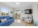 Living room with blue sofa, recliner, and access to balcony at 9560 Shore Dr. # 3A, Myrtle Beach, SC 29572