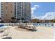 Community pool with picnic tables and lounge chairs at 9560 Shore Dr. # 3A, Myrtle Beach, SC 29572