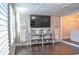 Modern living room with a large TV, decorative ladders, and a console table at 1005 S Marlin Circle, Murrells Inlet, SC 29576