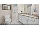 Guest bathroom with granite countertop and white cabinetry at 1023 Marthas Way, North Myrtle Beach, SC 29582