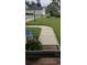 Front yard view of house and sidewalk at 1023 Marthas Way, North Myrtle Beach, SC 29582