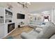 Living room with built-in shelving and hardwood floors at 1023 Marthas Way, North Myrtle Beach, SC 29582