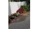 Landscaped side yard with flowers and brick border at 1023 Marthas Way, North Myrtle Beach, SC 29582