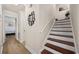 Elegant staircase with hardwood treads and white risers at 1023 Marthas Way, North Myrtle Beach, SC 29582