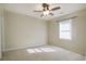 Carpeted bedroom with ceiling fan and large window at 104 Osprey Cove Loop, Myrtle Beach, SC 29588