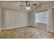 Spacious bedroom with hardwood floors and large windows at 104 Osprey Cove Loop, Myrtle Beach, SC 29588