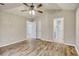 Bright bedroom with ceiling fan, hardwood floors and access to bathroom at 104 Osprey Cove Loop, Myrtle Beach, SC 29588