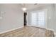 Dining area with hardwood floors, French doors, and neutral wall color at 104 Osprey Cove Loop, Myrtle Beach, SC 29588