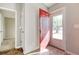 Bright entryway with red door, hardwood floor, and view of backyard at 104 Osprey Cove Loop, Myrtle Beach, SC 29588