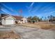 One-story house with attached garage and a large yard at 104 Osprey Cove Loop, Myrtle Beach, SC 29588