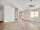 Open living area with red accent door, hardwood floors, and high ceiling at 104 Osprey Cove Loop, Myrtle Beach, SC 29588