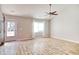 Living room with hardwood floors, ceiling fan, and access to front porch at 104 Osprey Cove Loop, Myrtle Beach, SC 29588