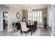 Elegant dining room featuring a chandelier, hardwood floors, and large windows at 1055 University Forest Dr., Conway, SC 29526