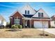 Brick front house with a two-car garage and manicured lawn at 1055 University Forest Dr., Conway, SC 29526