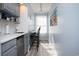 Small kitchenette with grey cabinets and a breakfast bar at 1055 University Forest Dr., Conway, SC 29526