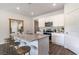 Modern kitchen with white cabinets, granite countertops, and stainless steel appliances at 1107 Black Lake Way, Conway, SC 29526