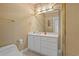 Clean bathroom with white vanity, gold fixtures and a large mirror at 117 Ashley River Rd., Myrtle Beach, SC 29588