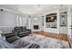 Spacious living room features a fireplace, built-in shelving, and hardwood floors at 117 Ashley River Rd., Myrtle Beach, SC 29588