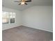 Large bedroom with ceiling fan and carpet flooring at 1574 Jardine Loop, Little River, SC 29566