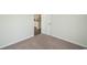 Carpeted bedroom with access to the kitchen at 1574 Jardine Loop, Little River, SC 29566